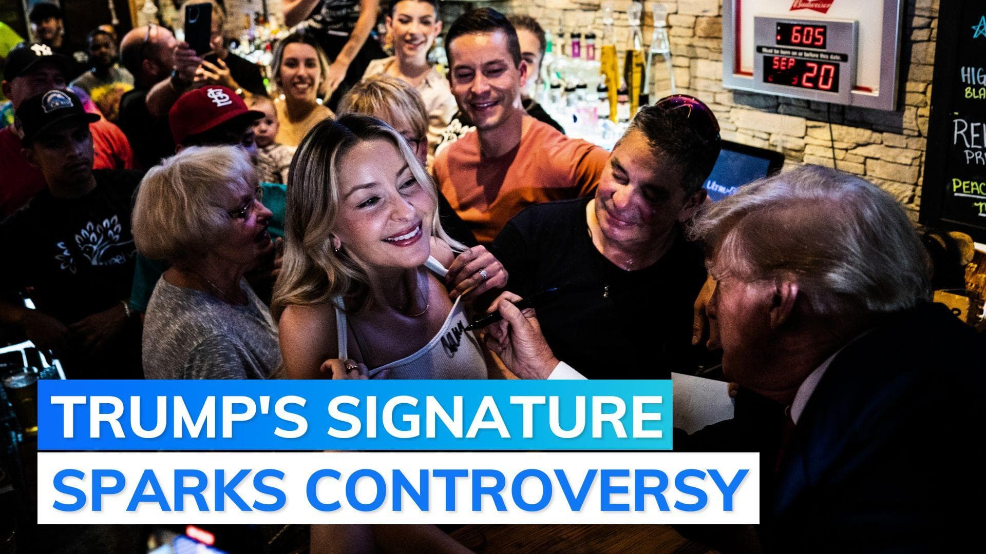 Donald Trump signs woman’s tank top, internet calls him ‘cheap, cheesy’