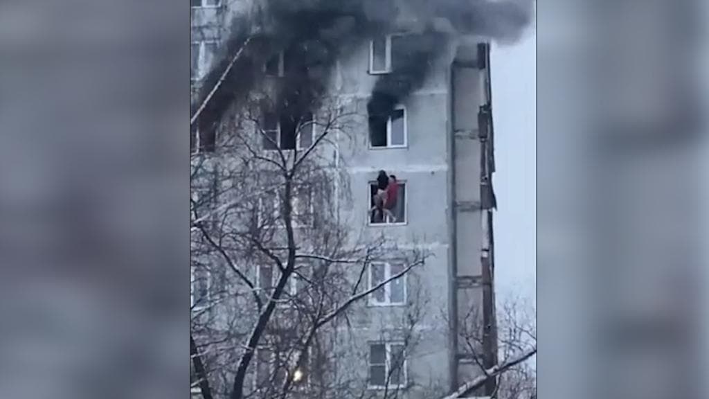 On camera: Woman rescued from burning house; video goes viral