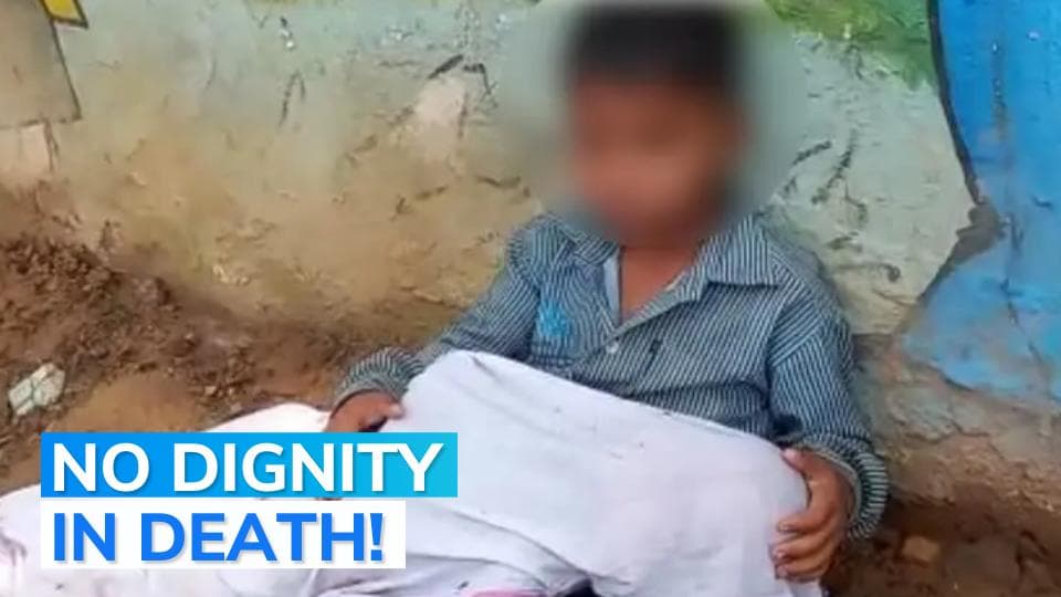 On camera:  8-yr-old sits with younger brother's body in lap outside MP hospital