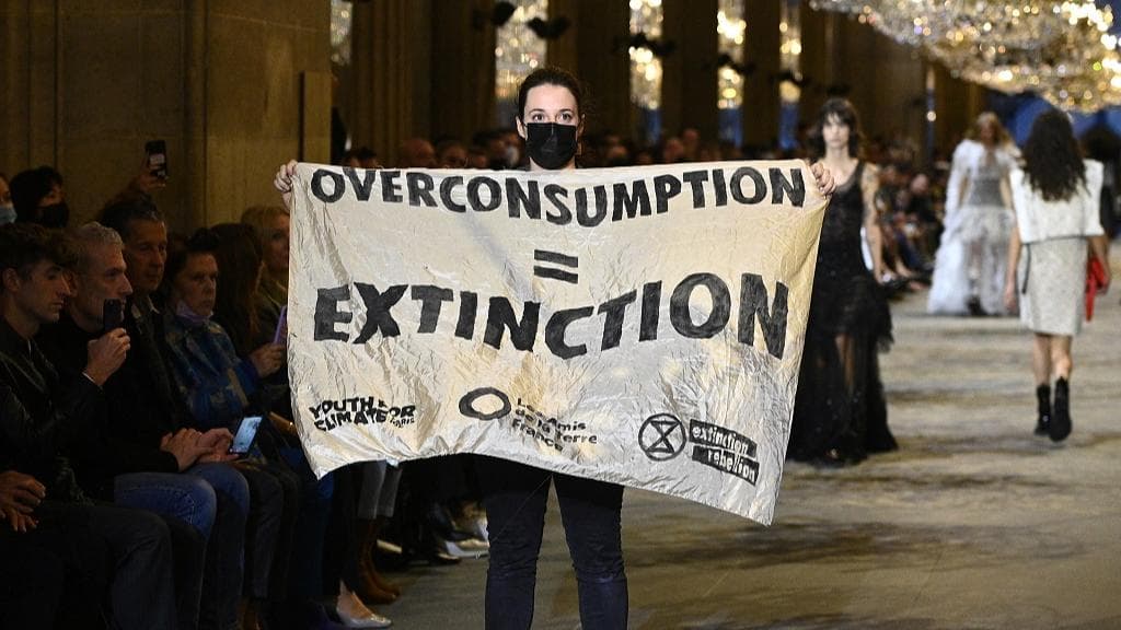 Paris Fashion Week: Things 'heat up' at the Louis Vuitton show, climate protester takes the stage