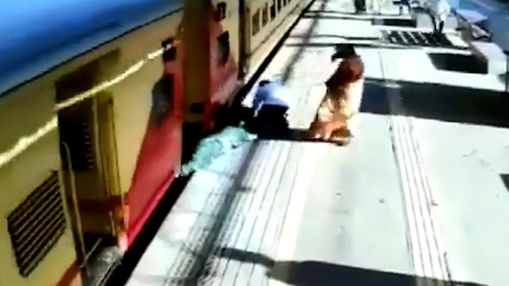 Watch: Woman slips while trying to board moving train, miraculously saved