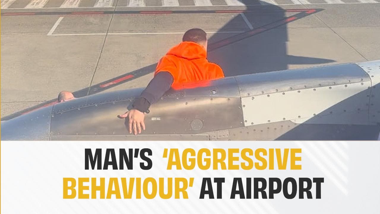 Man opens plane's door, walks on wing at Australian airport; arrested | Video