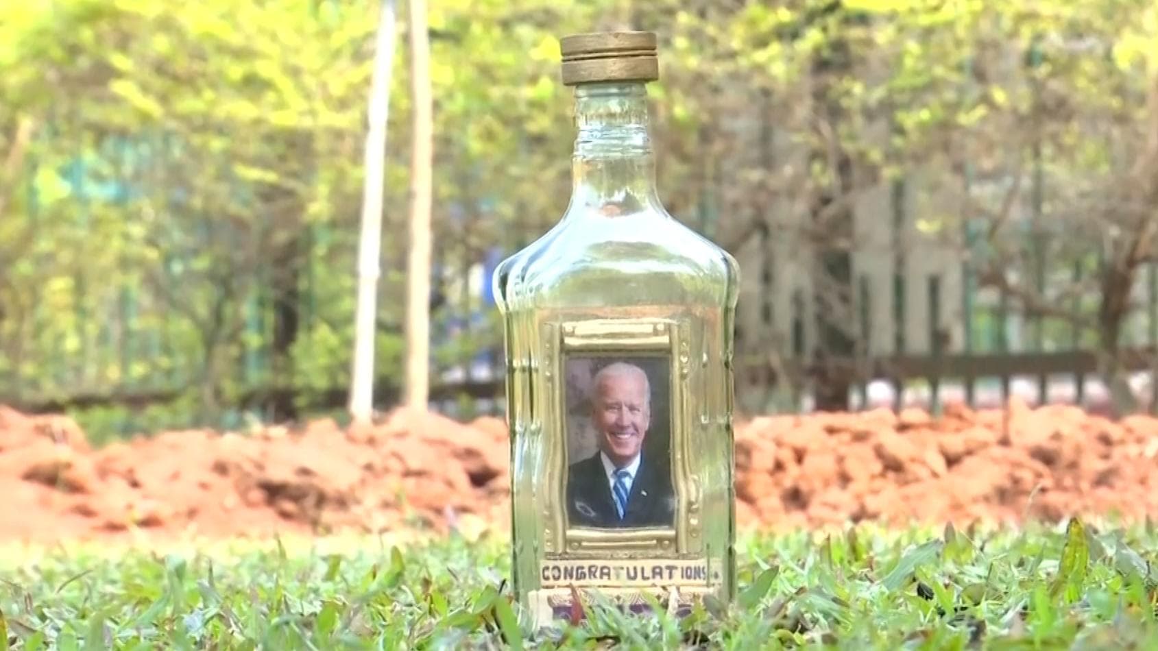 Renowned miniature artist crafts photo of Biden in a bottle!