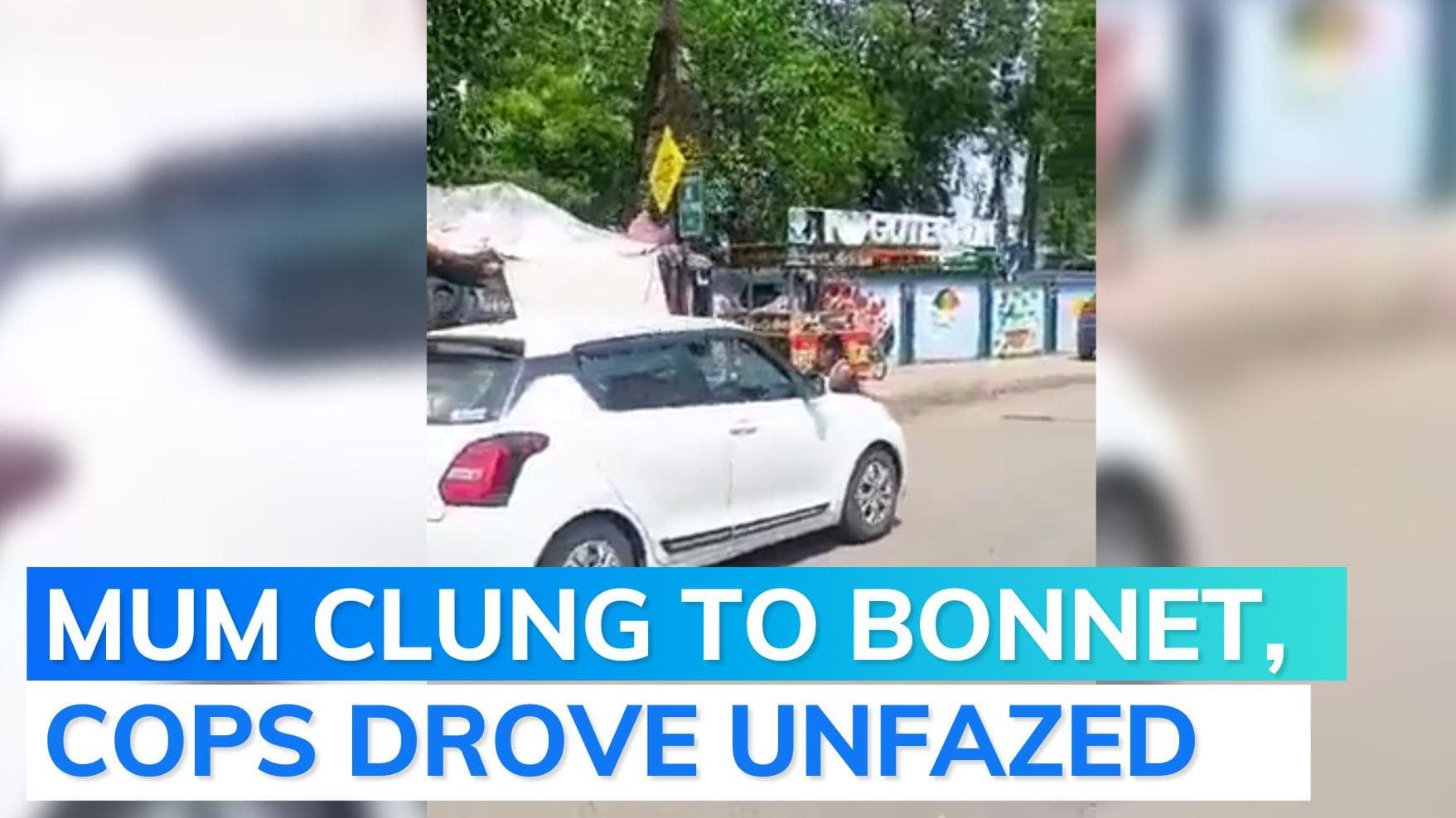 On cam: Woman jumps on car bonnet to prevent son’s arrest