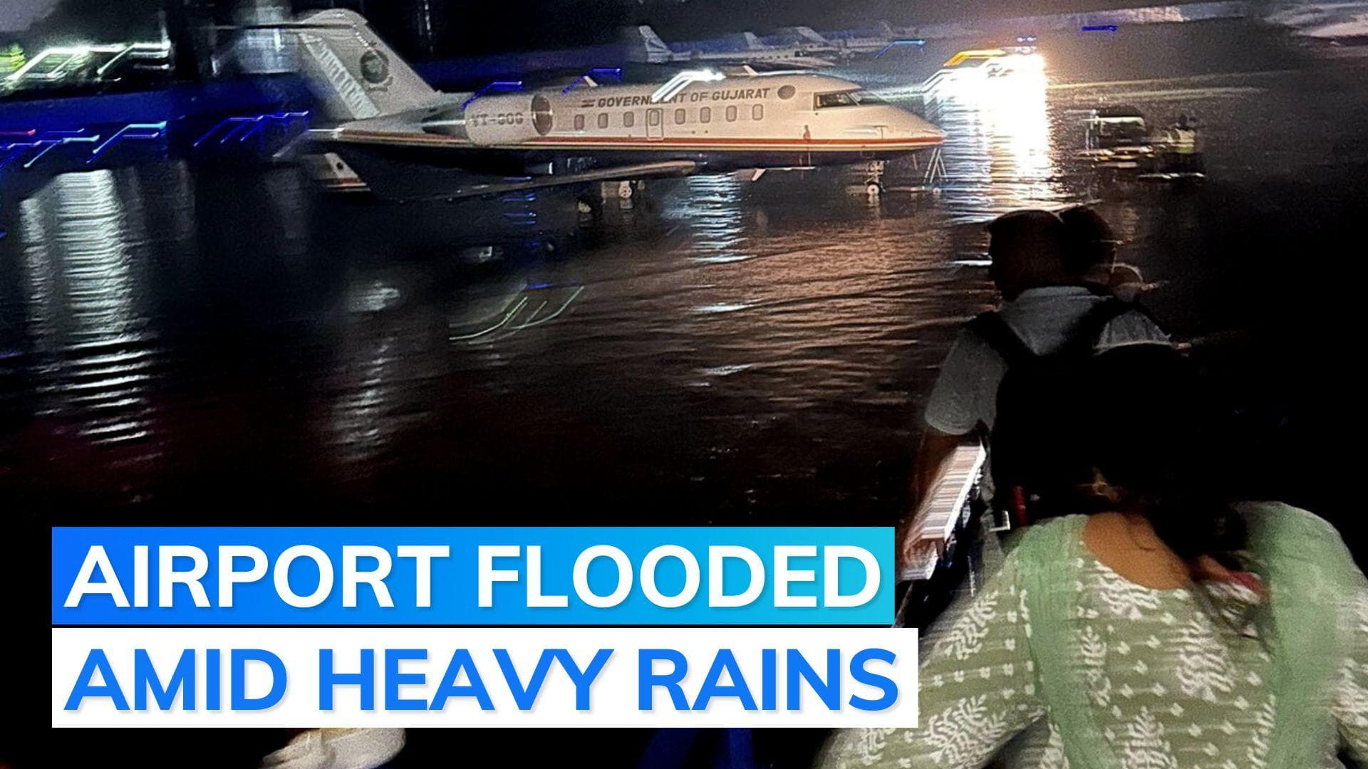 Watch | Passengers wade through knee-deep water at Ahmedabad airport