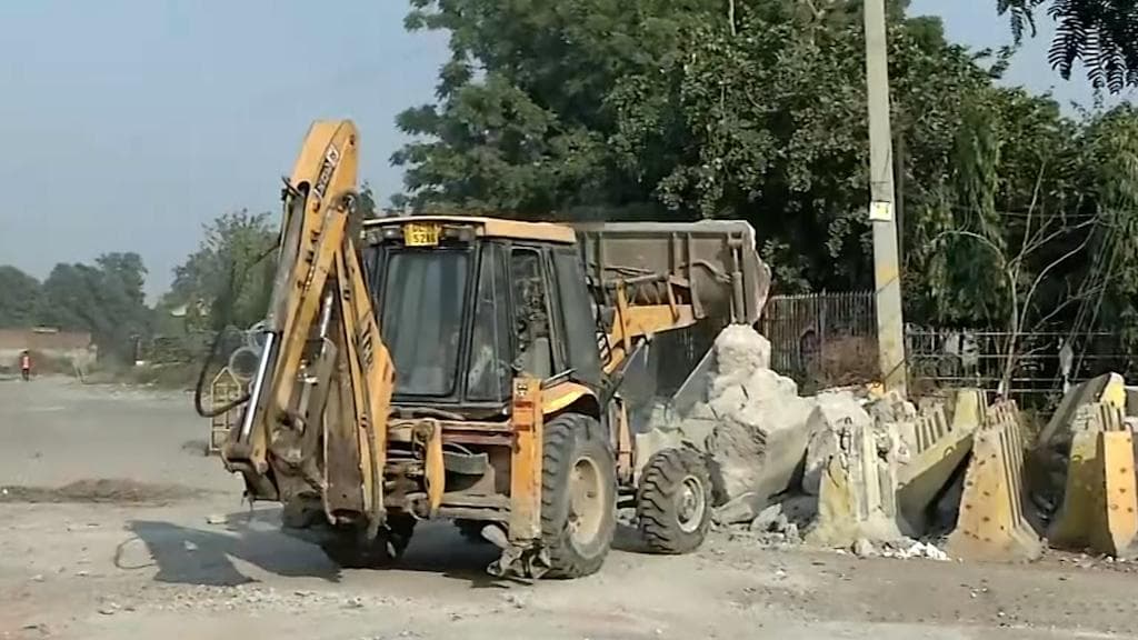 Watch: barricades being removed from Singhu border as farmers head home