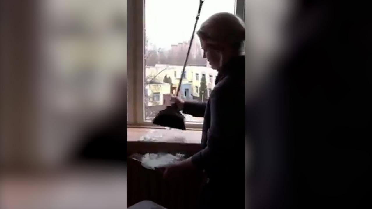 Watch: teary-eyed woman sings national anthem in her bombed Ukraine home