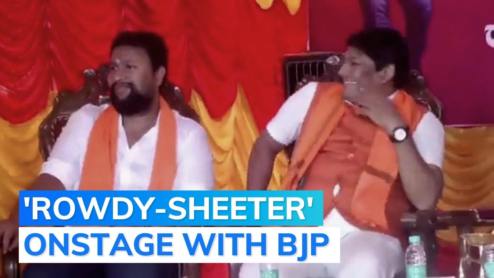 Karnataka: BJP leader issues clarification after 'absconding' criminal shares stage with party leaders