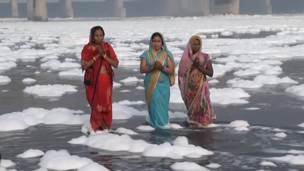 Political slugfest over Yamuna froth as devotees pray in toxic foam during Chhath
