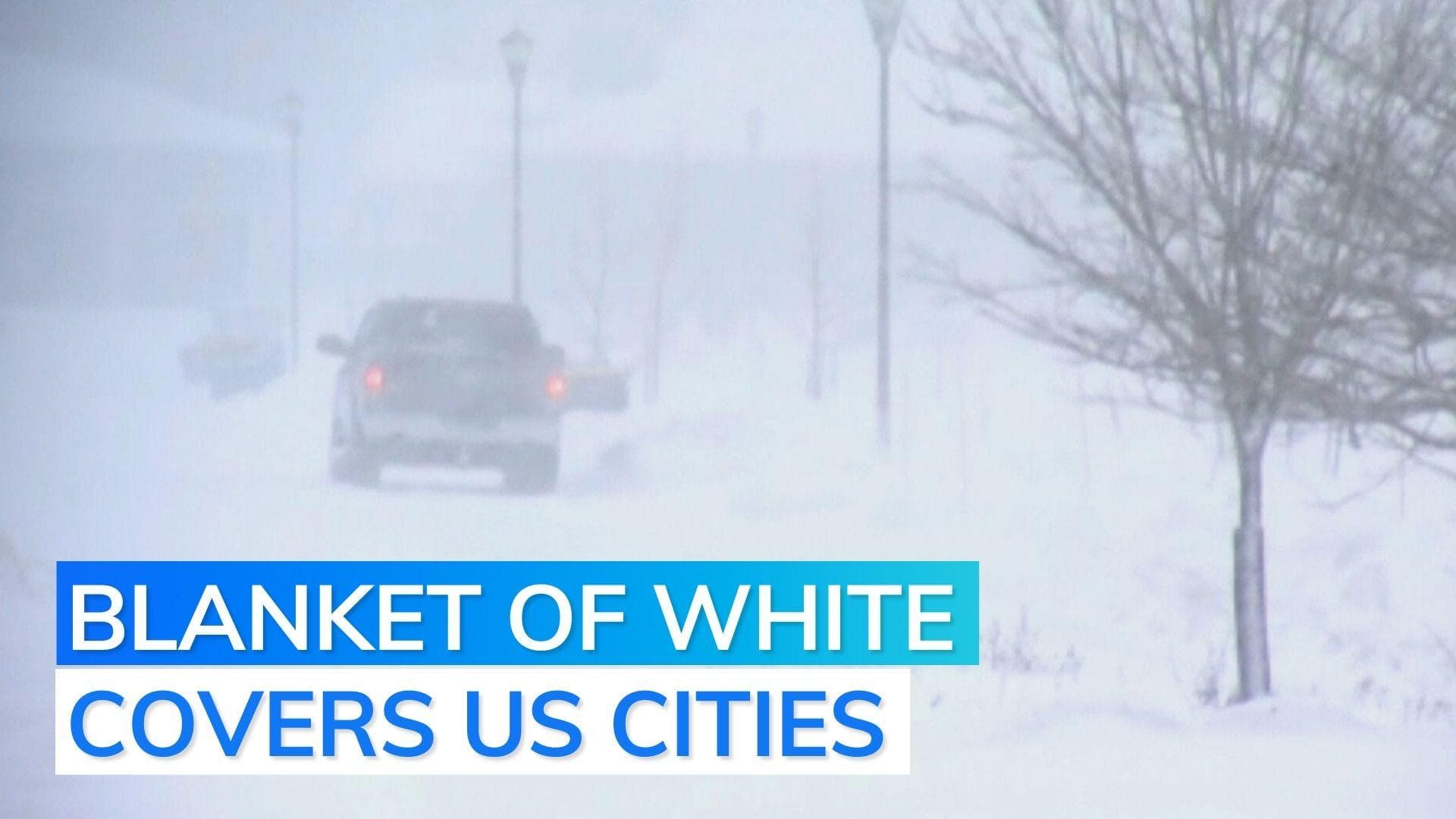 Watch: cities covered in white as blizzards hit northern US