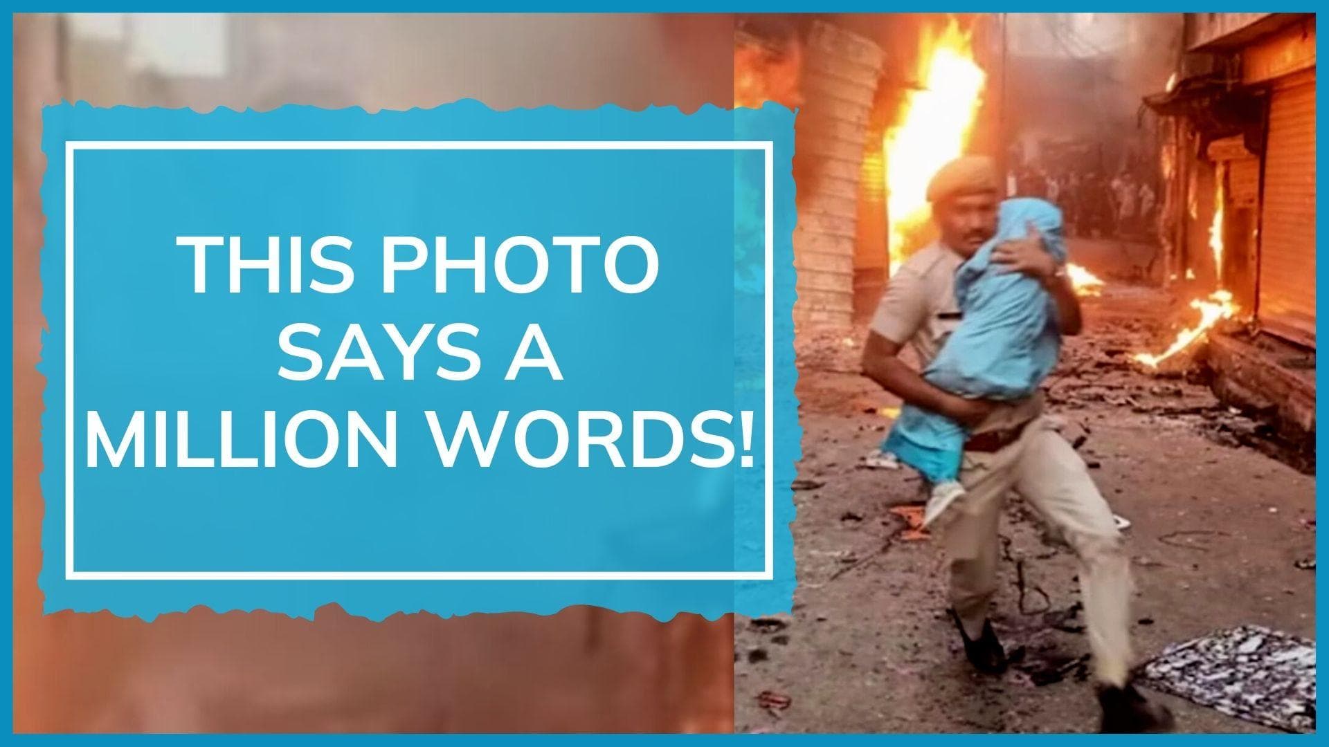 Cop saves child during violence in Rajasthan's Karauli; CM Ashok Gehlot calls and announces promotion