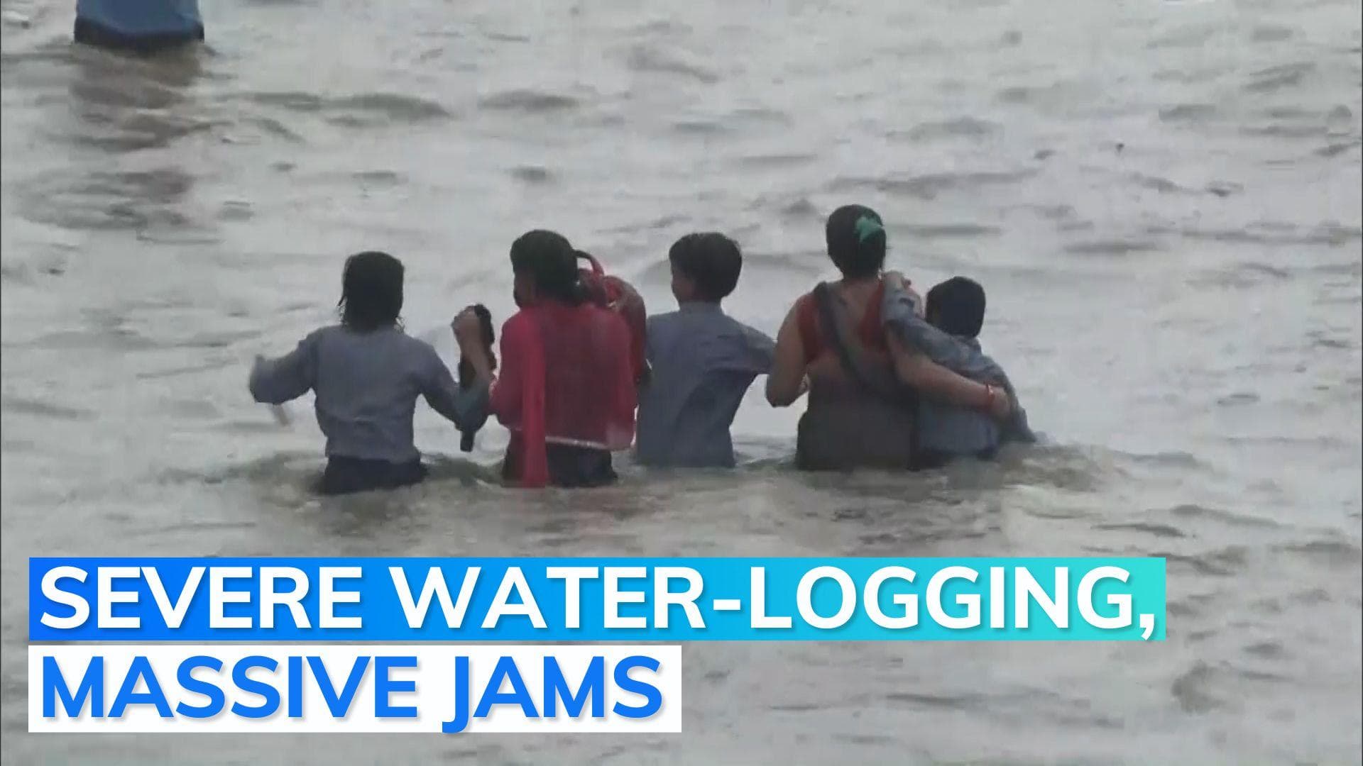 People wade through waist-high water as heavy rains lash Delhi NCR