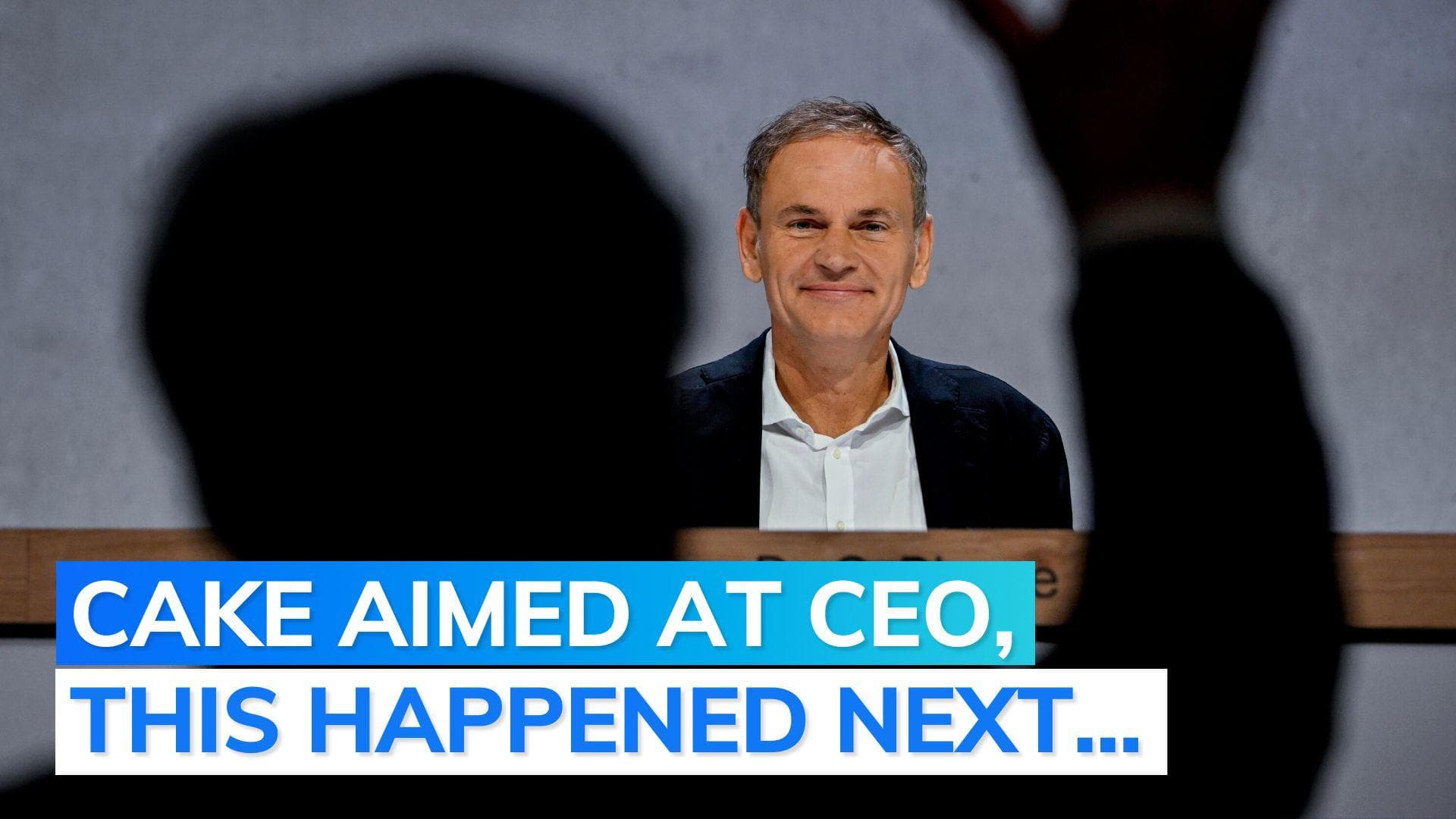 Protesters throw cake at Volkswagen bosses during shareholders' meet