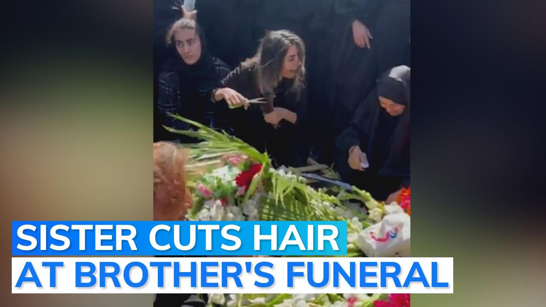 On camera: Iranian woman chops off hair at slain brother's funeral amid protests in country 