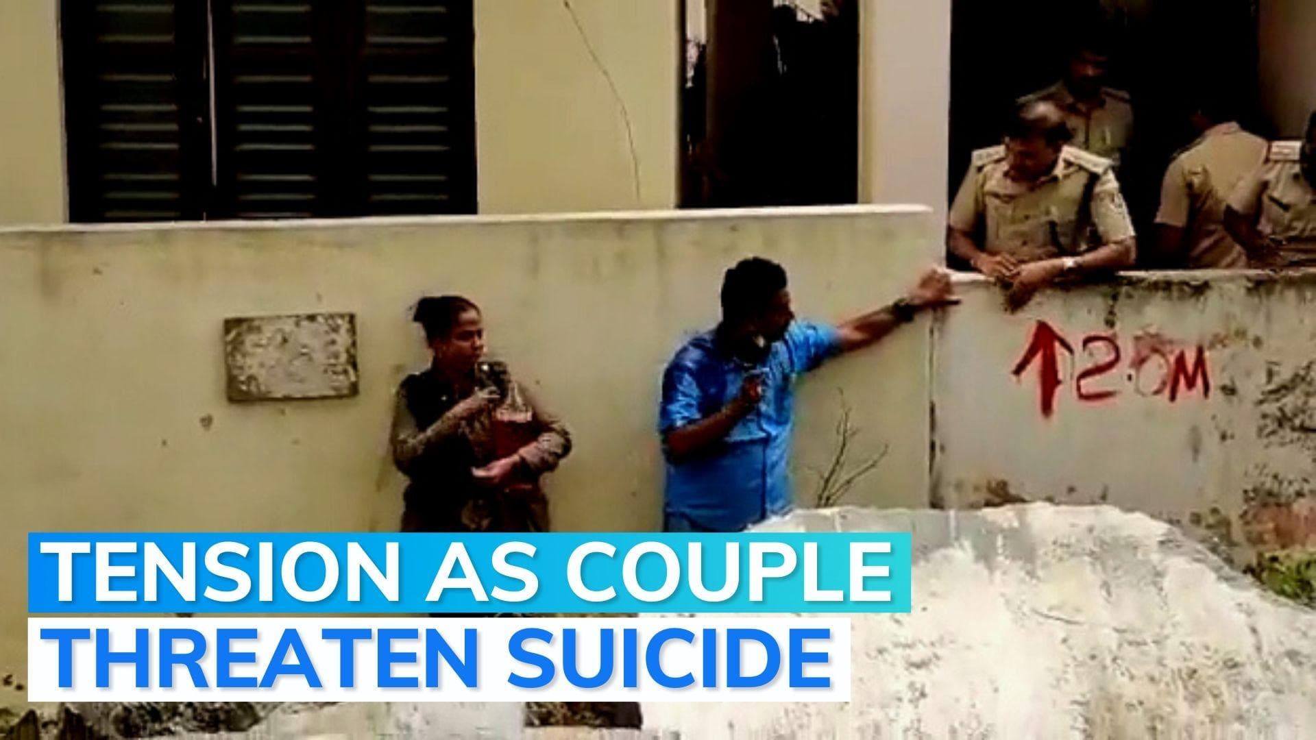 Watch: police foil Bengaluru couple’s immolation bid over demolition order