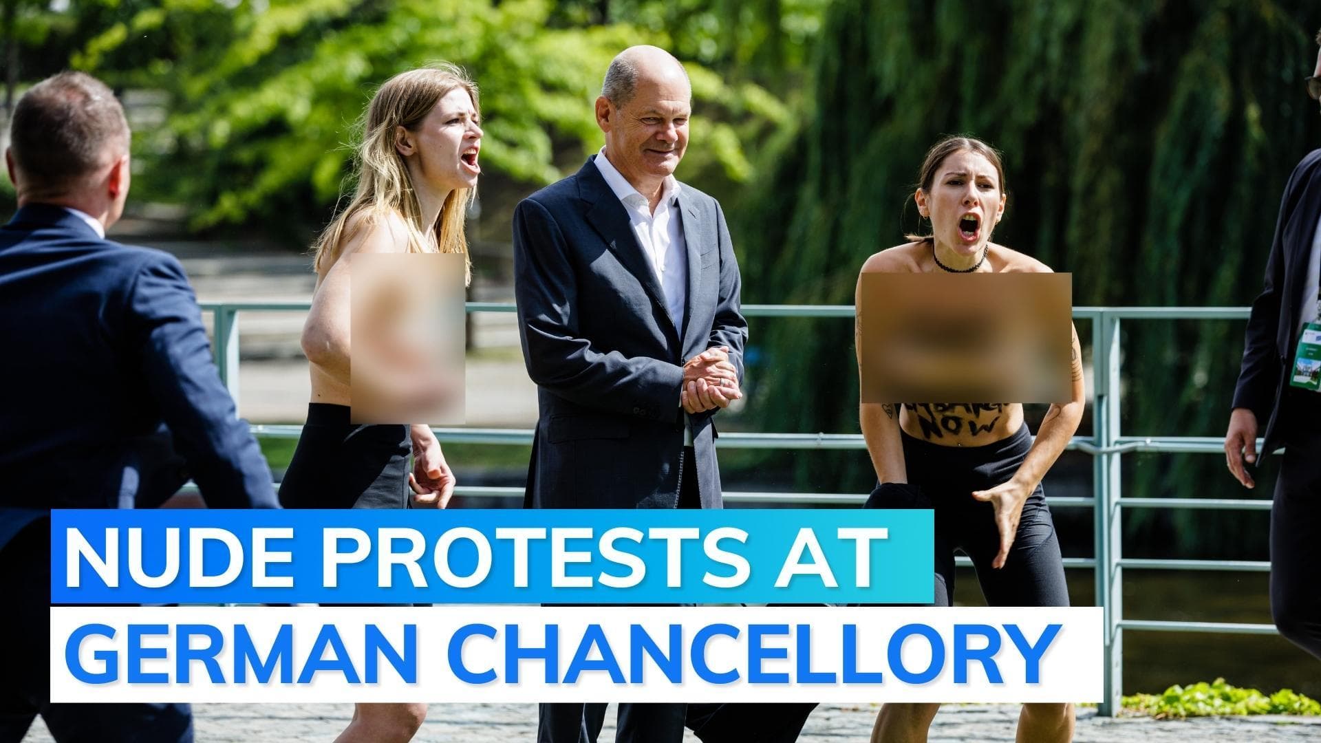 Topless protesters confront German Chancellor, demand 'gas embargo'