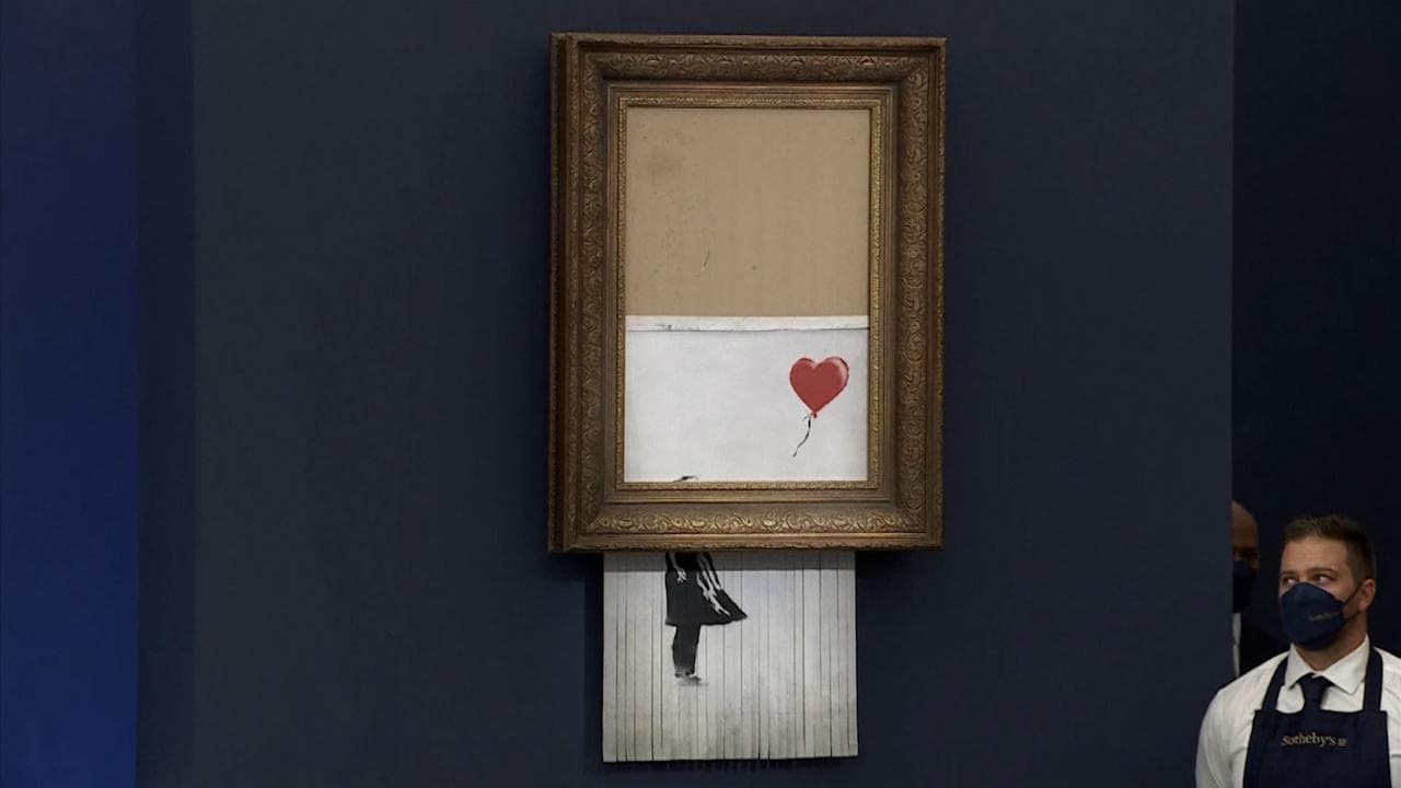 Shredded Banksy artwork sells for $25.4 million at Sotheby's auction in London